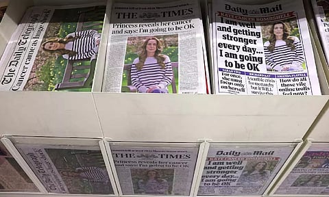 British newspaper front pages are displayed at a supermarket, all carrying the headline that Britain's Catherine, Princess of Wales has revealed she is undergoing preventative chemotherapy (Reuters)