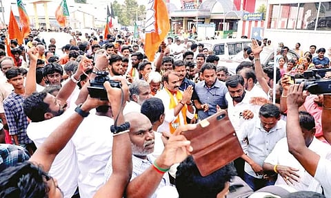 Minister L Murugan canvassing votes in Avinashi on Sunday