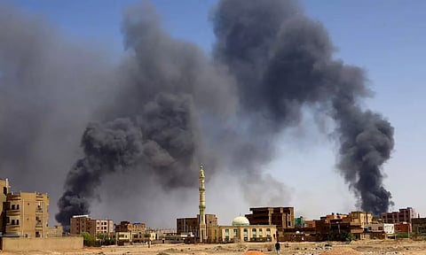 Smoke rises above buildings after aerial bombardment, during clashes between the paramilitary Rapid Support Forces and the army in Khartoum (Reuters)