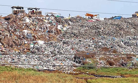 JCBs and other equipment cleaning mountain of junk piled up in Perungudi dumping yard, under South Chennai constituency (Photo: Justin George)