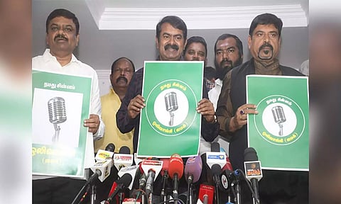 Naam Tamilar Katchi's Seeman with the Microphone symbol (X/@NaamTamilarOrg)