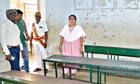 Election officer inspects poll booth
