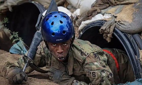 Tusajigwe Owens crawls out of a tunnel in the assault course at the U.S. Air Force Academy in Colorado Springs (Reuters)&nbsp;