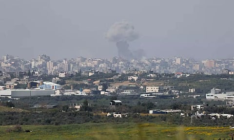 Smoke rises over Gaza following an explosion (Reuters)