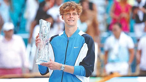 Jannik Sinner poses with the Jannik Sinner Miami Open trophy