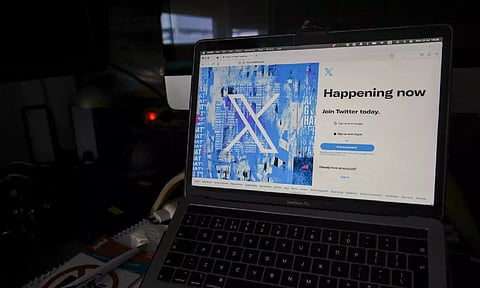 The X logo is shown on a computer screen (AP)