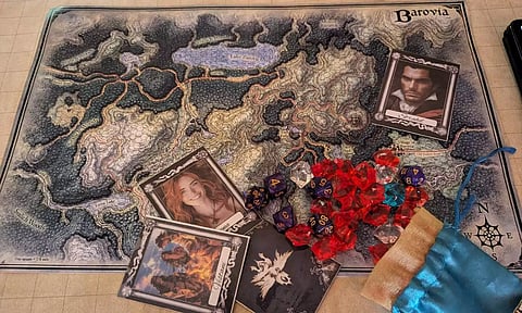 World map, the playing map, the characters, the dice, cards and the coins used for D&amp;D