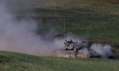 An Israeli tank maneuvers near the Israel-Gaza border