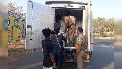 Elections staff check the vehicle of the private logistic firm