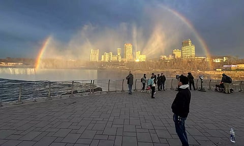 Rainbow forms over Niagara Falls as people wait for a solar eclipse at Niagara Falls in New York, U.S. (REUTERS)