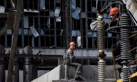 People work at a thermal power plant damaged by a recent Russian missile strike, amid Russia's attack on Ukraine (Reuters)