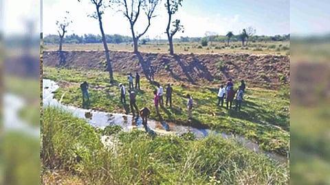 Officials examining the area