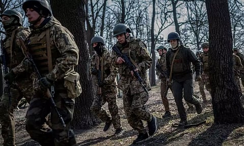 Volunteers who aspire to join the 3rd Separate Assault Brigade of the Ukrainian Armed Forces take part in a basic training (Reuters)