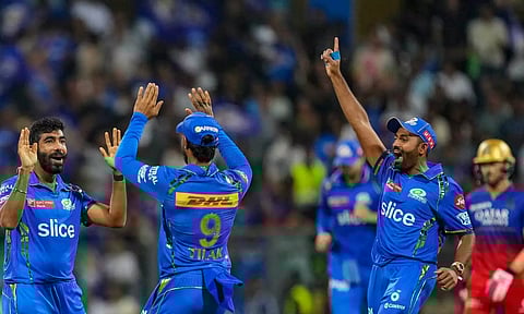 Mumbai Indians players celebrates after a wicket (PTI)
