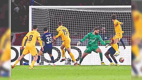 Andreas Christensen (3rd L) heads home Barcelona’s winner