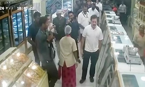Congress MP Rahul Gandhi at a sweet shop in Singanallur on Friday night. (ANI)
