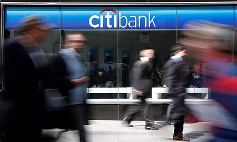 &nbsp;People walk past a CitiBank branch on Avenue of the Americas, in New York