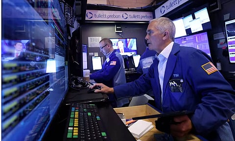 Traders work on the trading floor at the New York Stock Exchange (NYSE) in New York City (REUTERS)