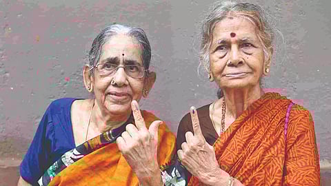 Two elderly women in South Chennai LS constituency flaunt their inked fingers on Friday (Photo: Justin George)