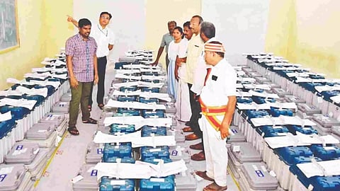 Tiruchy Returning Officer M Pradeep Kumar checking on the sealed EVMs kept in strong room at Jamal Mohamed College on Saturday