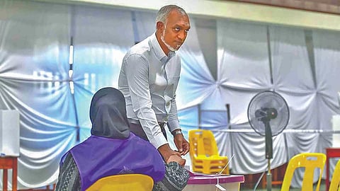 Muizzu arrives to cast his ballot for parliamentary election at a polling station in Mali, on Sunday