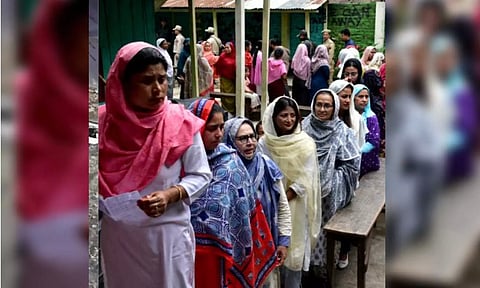 People standing in queue (Reuters)