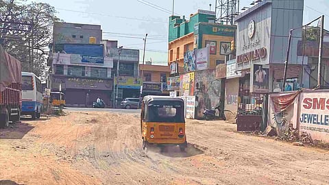 The muddy Rose Mahal Road in Tiruvallur