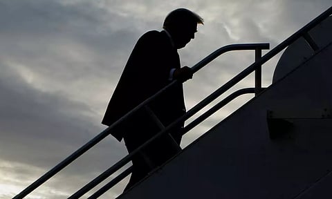 Former U.S. President and Republican presidential candidate Donald Trump boards his plane to depart from Eastern Iowa Airport after campaigning in Cedar Rapids, Iowa, U.S.