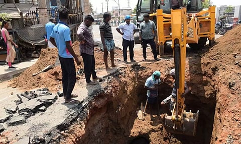 Workers involved in repair works at Thiruvanaikovil near Shrirangam on Friday