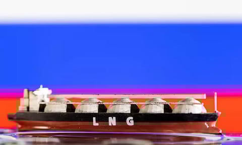Model of LNG tanker is seen in front of Russia's flag (Reuters)