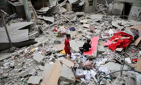 Palestinian children inspect the site of an Israeli strike on a house, amid the ongoing conflict between Israel and the Palestinian Islamist group Hamas, in Rafah, in the southern Gaza Strip (REUTERS)