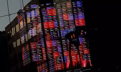 A huge electric stock quotation board is seen inside a building in Tokyo (Reuters)