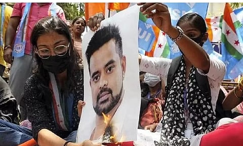 A poster of Prajwal Revanna being burnt amid the sex abuse row in Hassan (PTI)