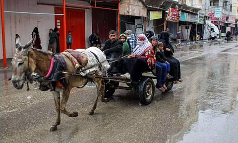 People flee the eastern parts of Rafah after the Israeli military began evacuating Palestinian civilians ahead of a threatened assault on the southern Gazan city (Reuters)