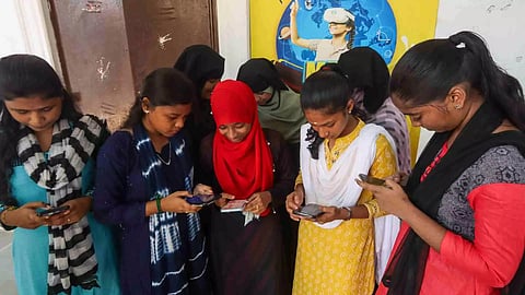 Students checking their results in phone (Photo/Hemanathan M)