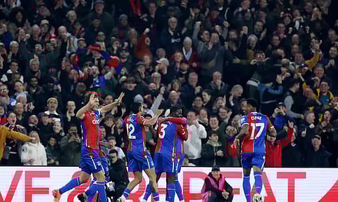 Crystal Palace's Tyrick Mitchell celebrates scoring their third goal with teammates (Reuters)