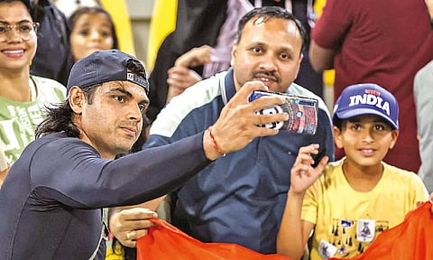 Neeraj Chopra takes a selfie with supporters after men’s Javelin final at Diamond League