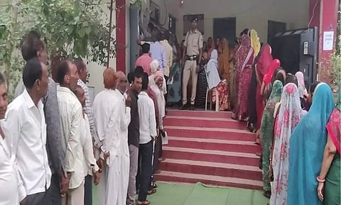 Voters queue up outside Borawan polling booth in Khargone (ANI)