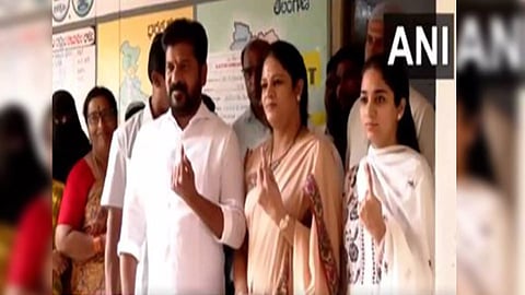 Telangana Chief Minister Revnath Reddy, his family members show their inked fingers after casting their votes. (Photo/ANI)