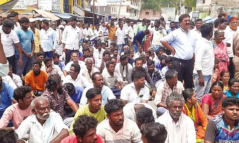 Villagers block the road protesting against the elephant attack which led to the death of a farmer in Krishnagiri