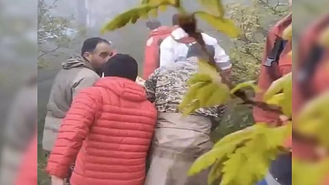 Rescuers move the bodies of those killed in the Chopper crash (Photo/X @PressTV)