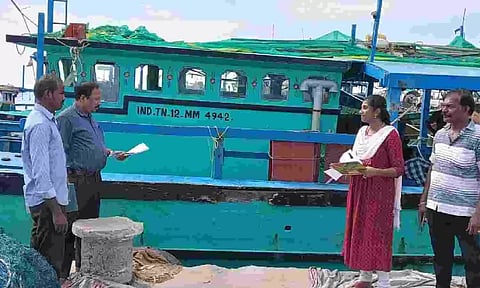 Fisheries Department officials inspecting mechanised boats anchored in Thoothukudi harbour on Tuesday&nbsp;