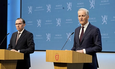 Norway's Prime Minister Jonas Gahr Store (R) with Foreign Minister Espen Barth Eide (L), speaks during a news conference in Oslo, Norway on Wednesday (AP)