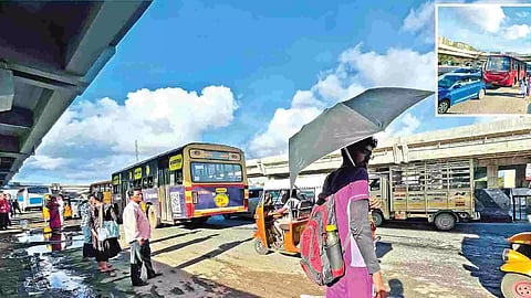 Commuters in Perungalathur waiting for the bus towards the end of a flyover