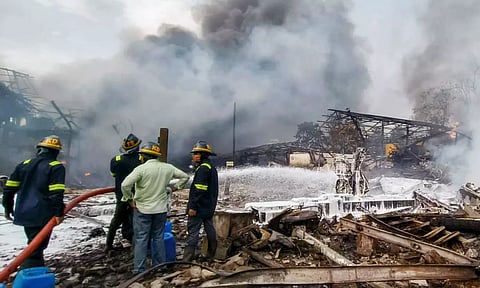 Firefighters try to extinguish a fire that broke out due to a boiler blast in a chemicals factory in Thane district (PTI)