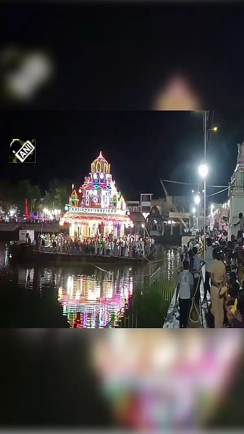 Devotees participate in 'Theppa Thiruvizha' festival at Sri Thyagarajaswamy Temple in Tamil Nadu