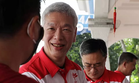 Lee Hsien Yang of the Progress Singapore Party meets residents ahead of the general election in Singapore (Reuters)