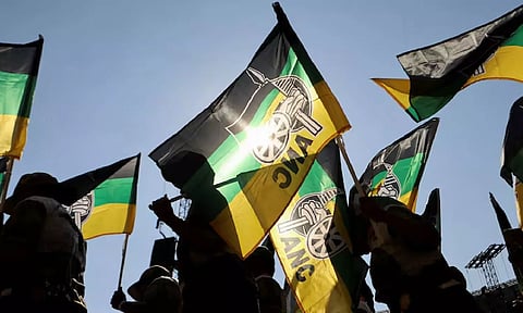 Supporters of the African National Congress (ANC) wave party flags during their final rally ahead of the upcoming election&nbsp;