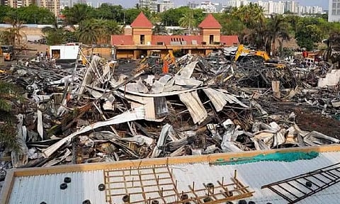 JCB machines remove debris from the site after a massive fire broke out at a Game zone, in Rajkot on Saturday (ANI)