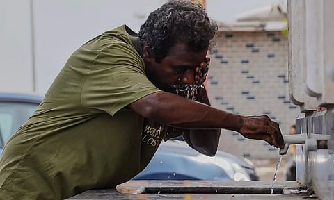 A man washes his face to beat the heat. (Photo | Deepak ST)
